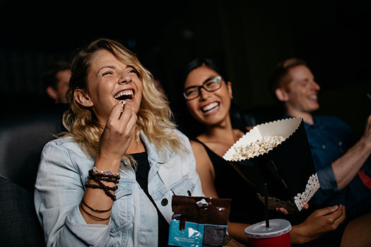 girls enjoying cinema trip